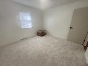 3872 South Hillcrest Road Knox, IN 46534 - Photo 11 of 27 an empty room with a window