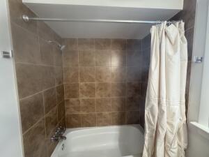 3872 South Hillcrest Road Knox, IN 46534 - Photo 13 of 27 a bathroom with a shower and a tub