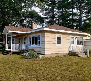 3872 South Hillcrest Road Knox, IN 46534 - Photo 16 of 27 a view of a house with a yard and sitting area