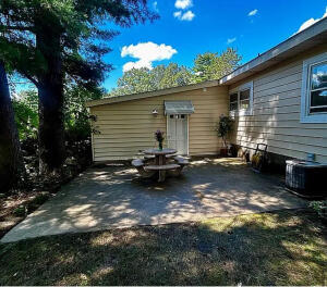 3872 South Hillcrest Road Knox, IN 46534 - Photo 19 of 27 a backyard of a house with barbeque oven fire pit table and chairs