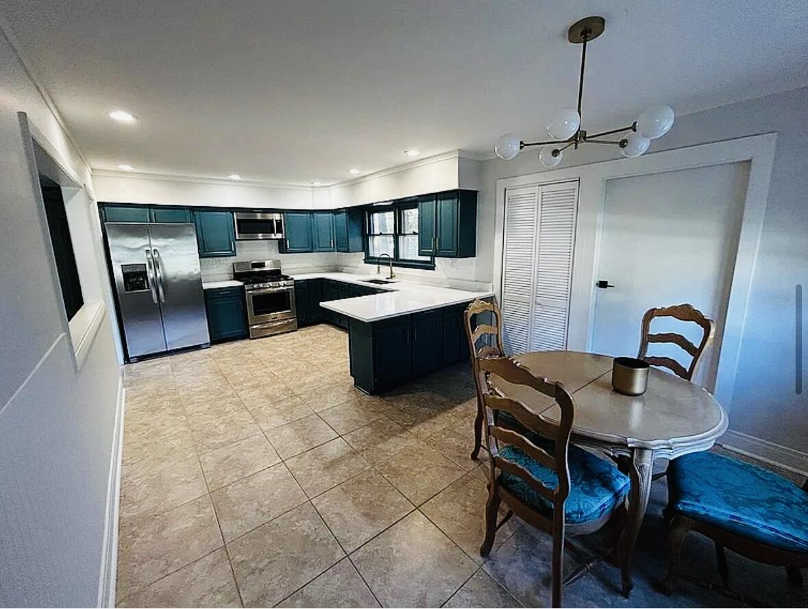3872 South Hillcrest Road Knox, IN 46534 - Photo 3 of 27 a living room with furniture a rug and kitchen view