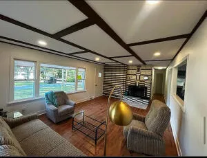 a living room with furniture or couch and a large window