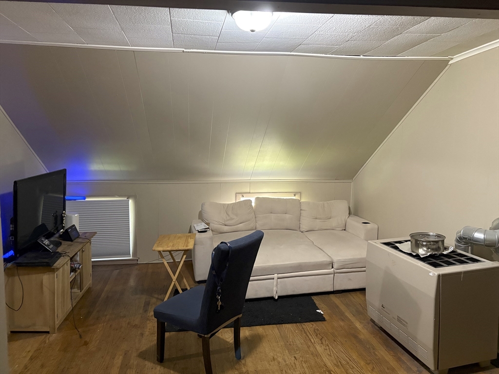 913 Rodman Street Fall River, MA 02721 - Photo 11 of 13 a living room with a couch and a flat screen tv