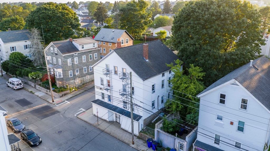 913 Rodman Street Fall River, MA 02721 - Photo 3 of 13 an aerial view of a house with a yard