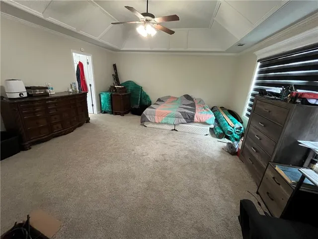 a room with furniture and a flat screen tv