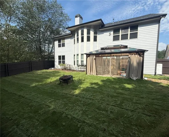 a house view with a outdoor space