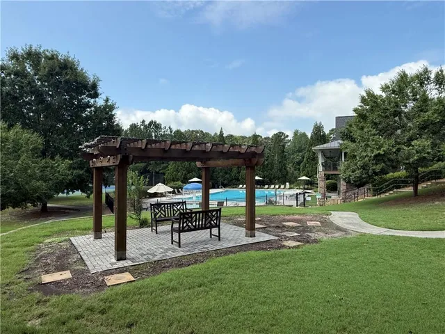 a view of a park with large trees