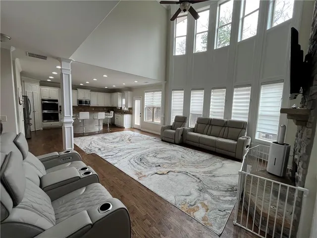 a living room with furniture fireplace and flat screen tv