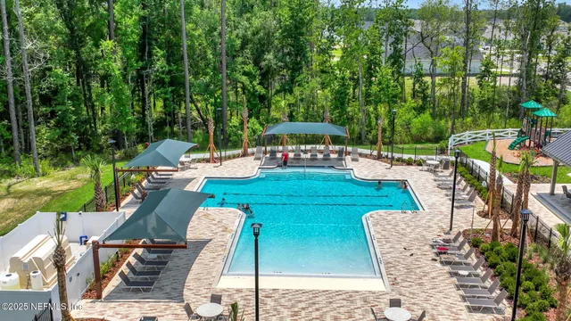 swimming pool view with seating space