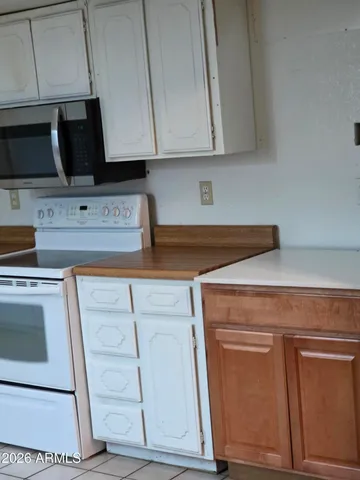 a view of cabinets and wooden floor