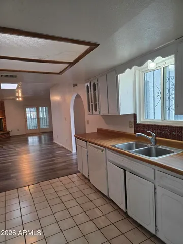 a kitchen with a sink and cabinets
