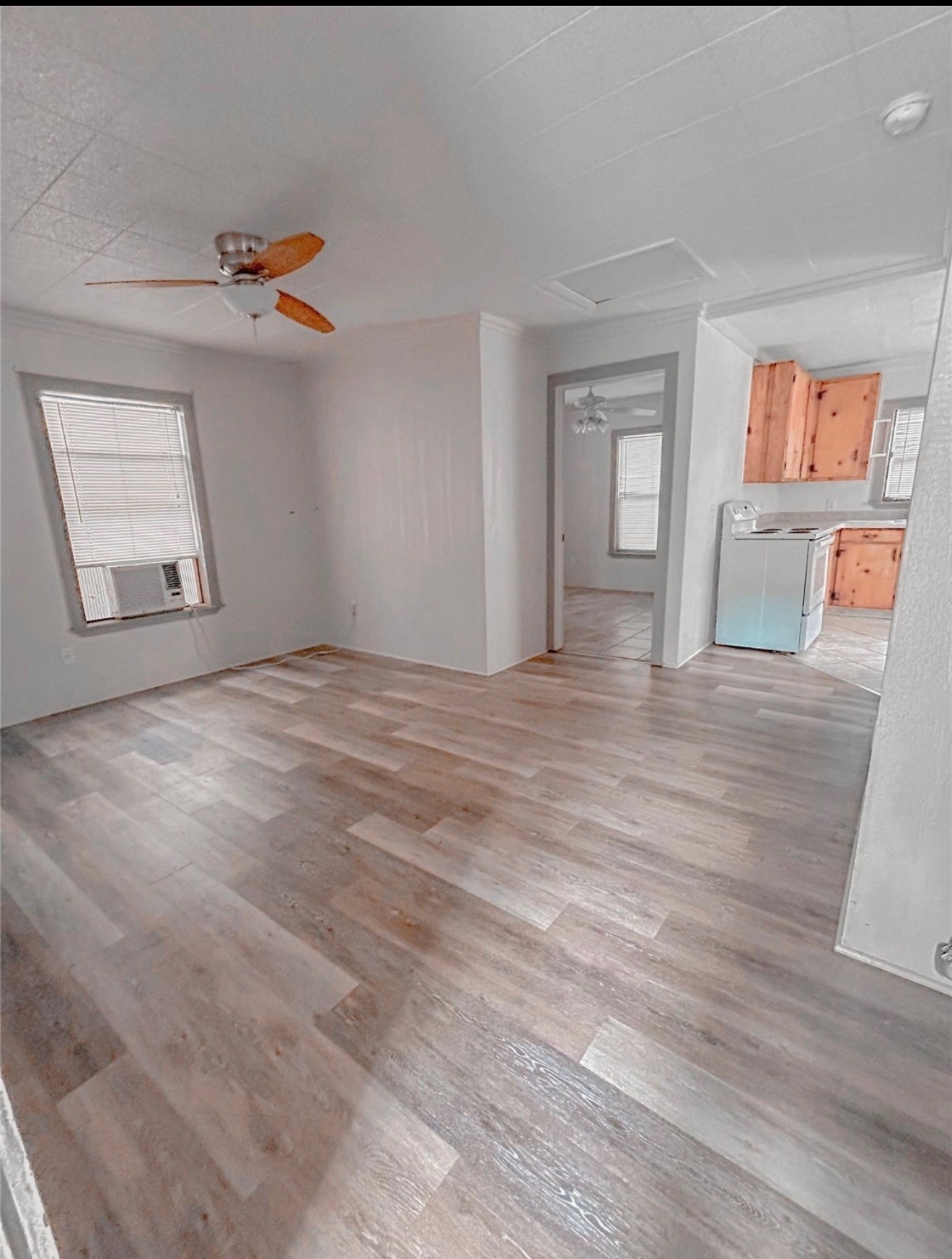3005 Old Houston Road, Unit C Huntsville, TX 77340 - Photo 4 of 4 a view of an empty room with a window and wooden floor