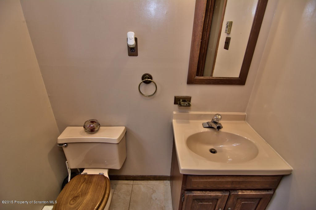 28 Elias Road Moscow, PA 18444 - Photo 11 of 69 a bathroom with a sink mirror and toilet