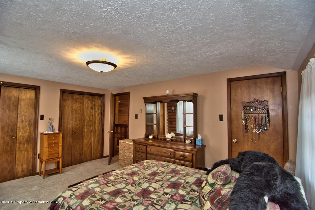 28 Elias Road Moscow, PA 18444 - Photo 24 of 69 a bedroom with a bed and a couch