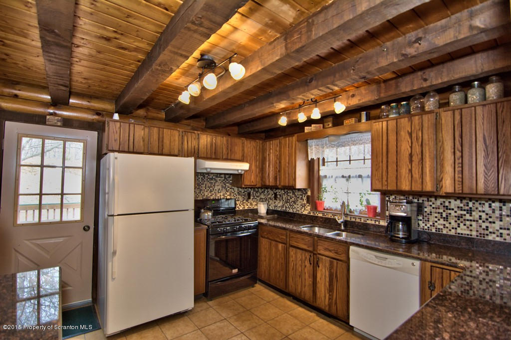 28 Elias Road Moscow, PA 18444 - Photo 58 of 69 a kitchen with a refrigerator and a sink
