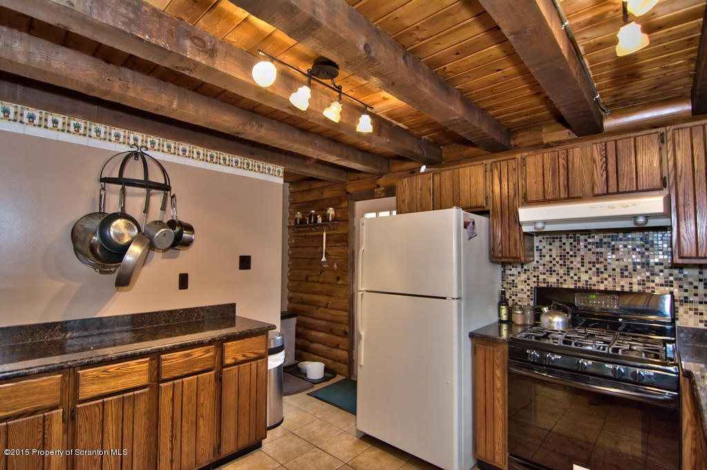 28 Elias Road Moscow, PA 18444 - Photo 62 of 69 a kitchen with a refrigerator and a stove