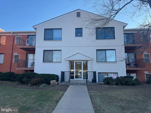 a front view of a house with yard