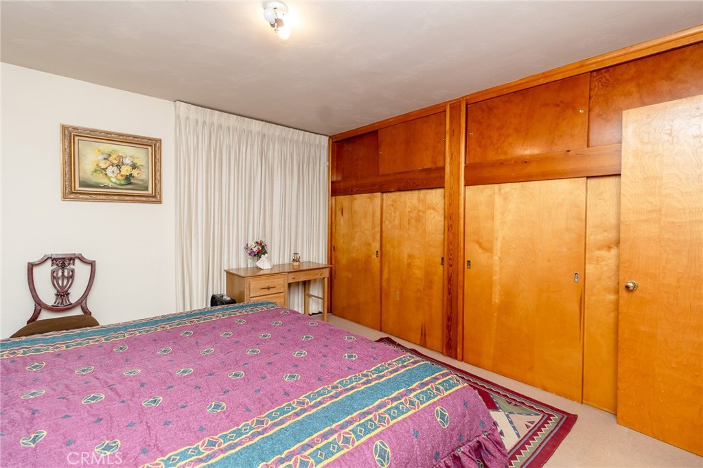 630 Acoma Street Needles, CA 92363 - Photo 17 of 60 a bedroom with a bed and a window