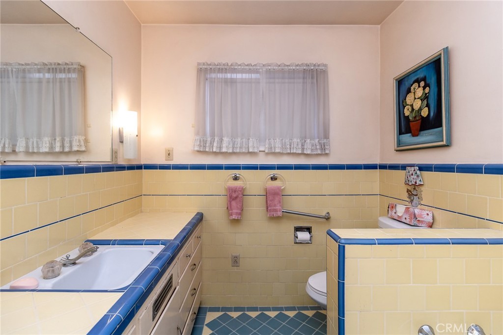 630 Acoma Street Needles, CA 92363 - Photo 18 of 60 a bathroom with a sink and a toilet