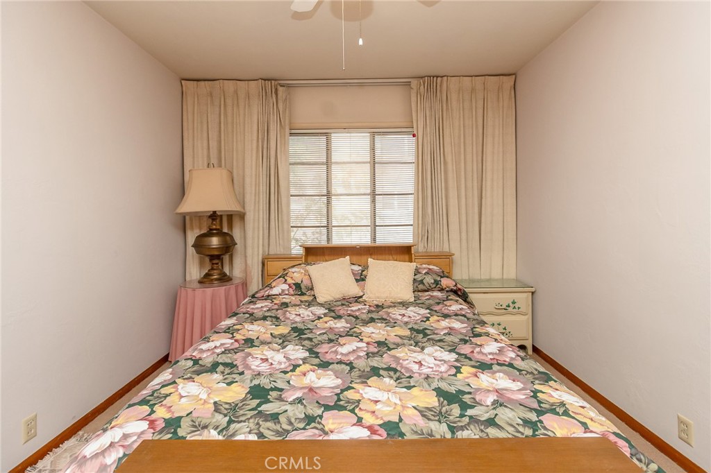 630 Acoma Street Needles, CA 92363 - Photo 22 of 60 a large bed sitting in a bedroom next to a window