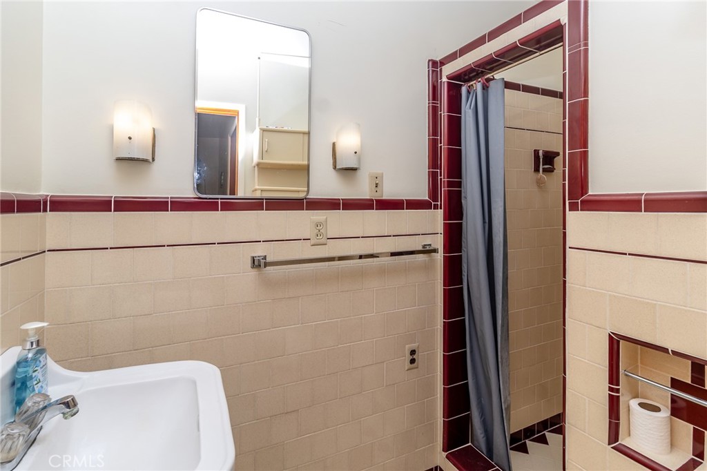 630 Acoma Street Needles, CA 92363 - Photo 24 of 60 a bathroom with a sink and mirror