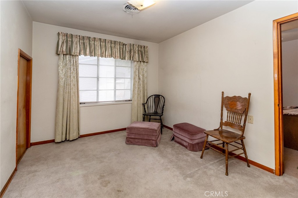 630 Acoma Street Needles, CA 92363 - Photo 26 of 60 a living room with furniture and a window