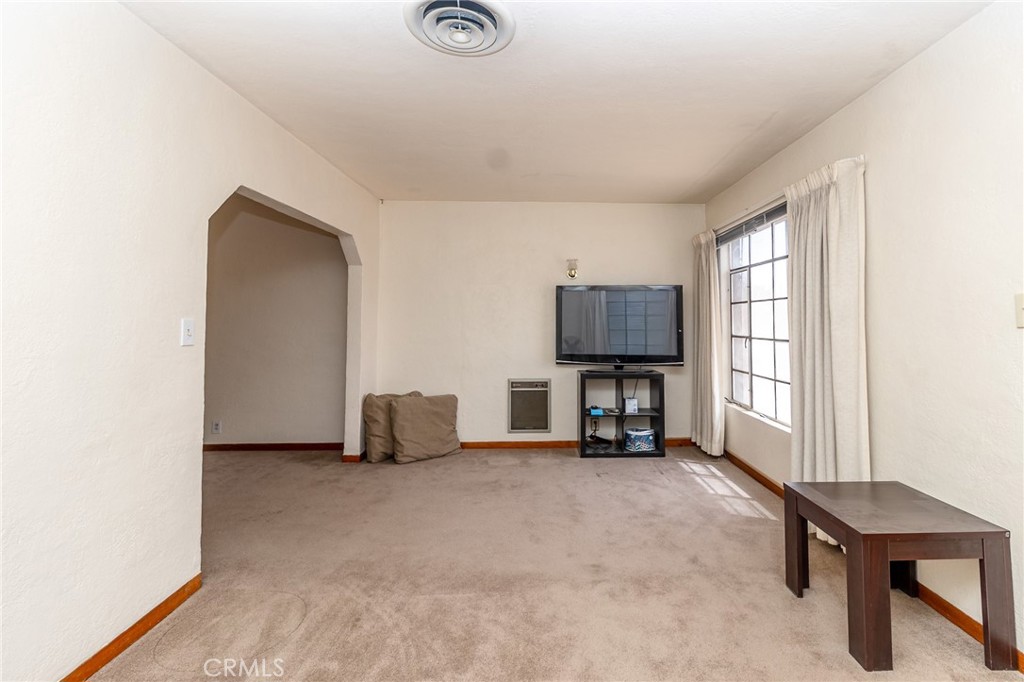 630 Acoma Street Needles, CA 92363 - Photo 35 of 60 a living room with furniture and a flat screen tv