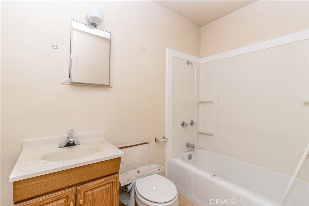 630 Acoma Street Needles, CA 92363 - Photo 54 of 60 a bathroom with a sink a toilet and shower