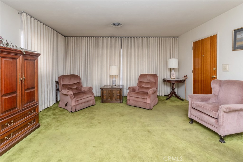 630 Acoma Street Needles, CA 92363 - Photo 6 of 60 a living room with furniture and a window