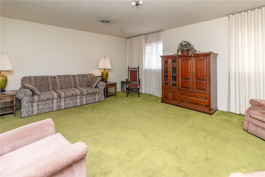 630 Acoma Street Needles, CA 92363 - Photo 7 of 60 a living room with furniture and a window