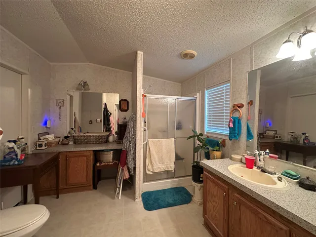 a room with a view of kitchen island dining table and chairs