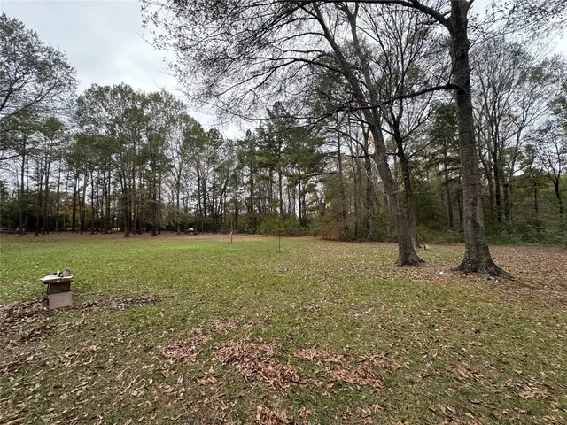 a view of outdoor space with deck and yard