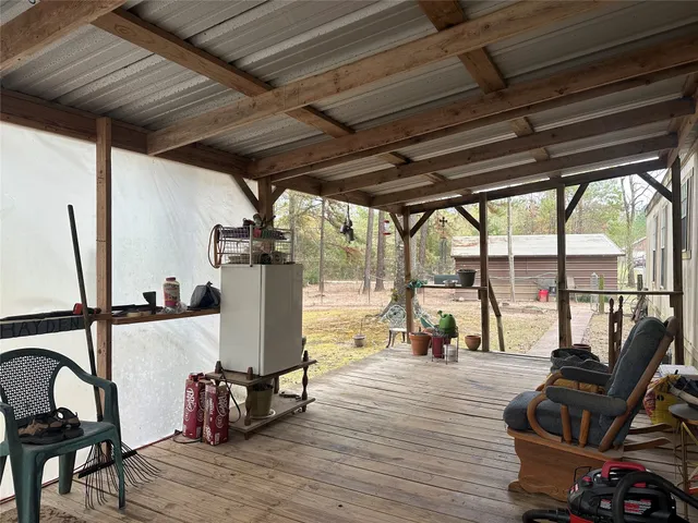 a view of living room with furniture and floor to ceiling window