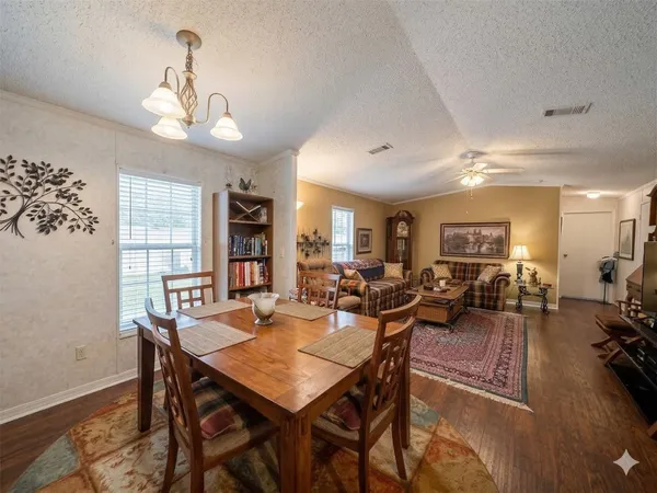 a view of a kitchen island a sink and living room
