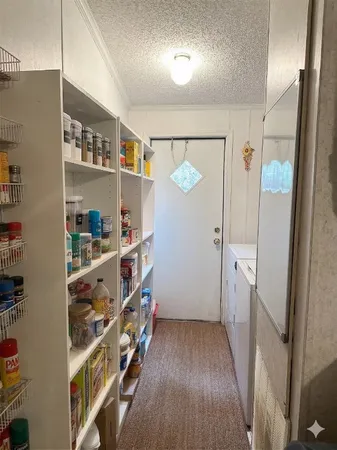 a bedroom with a bed and a tv