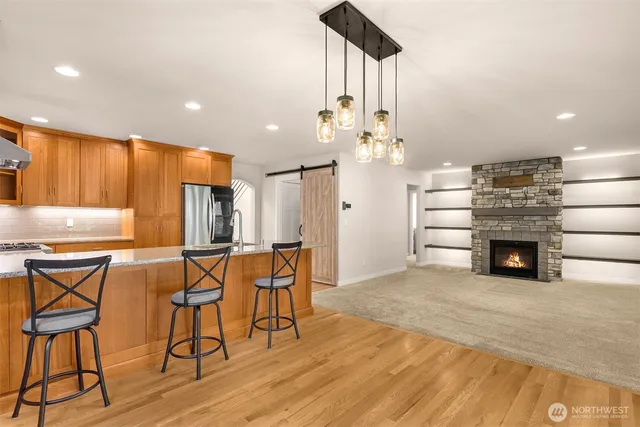 a view of a kitchen with furniture and chandelier