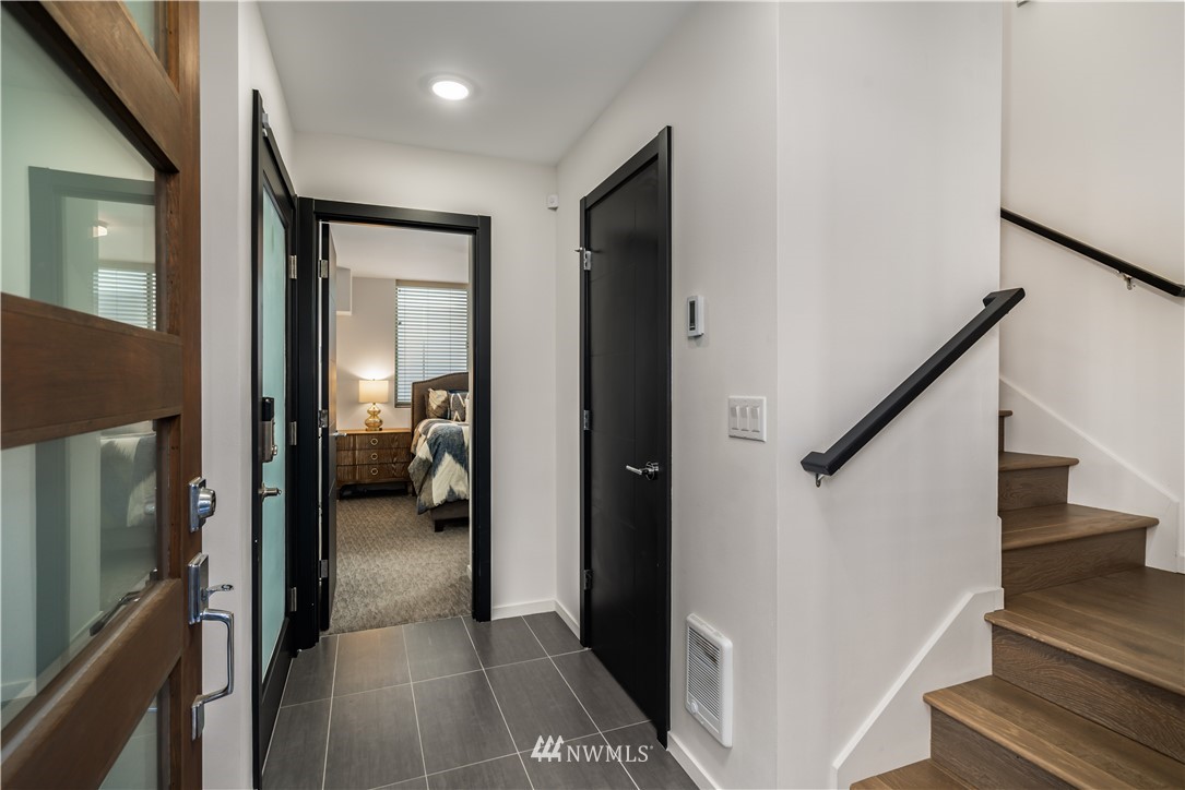 742 North 95th Street Seattle, WA 98103 - Photo 3 of 32 a view of a hallway with a livingroom and stairs
