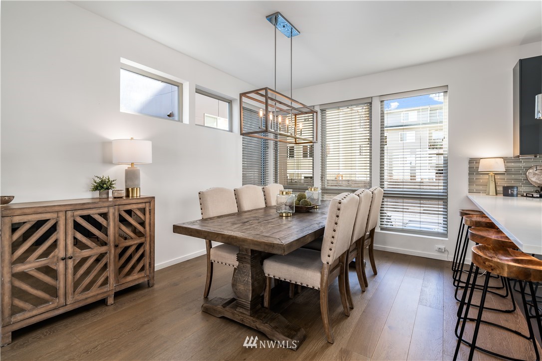 742 North 95th Street Seattle, WA 98103 - Photo 8 of 32 a view of a dining room with furniture window and wooden floor