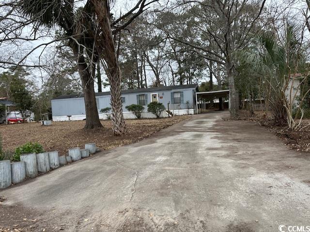 4646 Misty Lane Myrtle Beach, SC 29588 - Photo 1 of 10 Manufactured / mobile home featuring a carport and