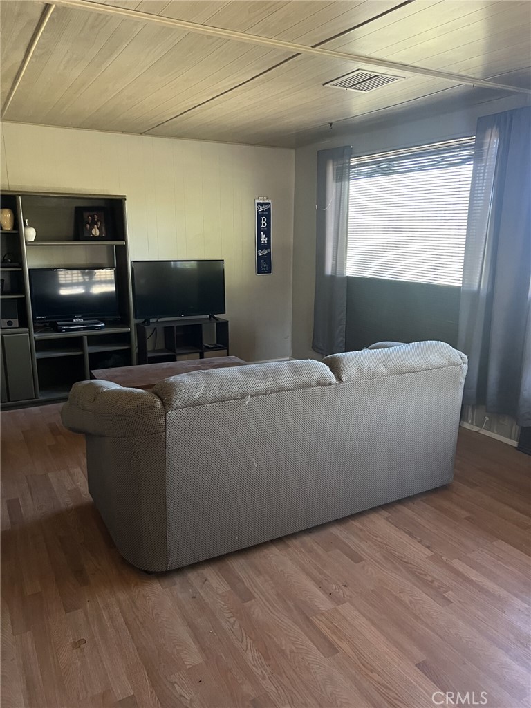 31596 Allen Avenue Homeland, CA 92548 - Photo 13 of 22 a living room with furniture and a flat screen tv