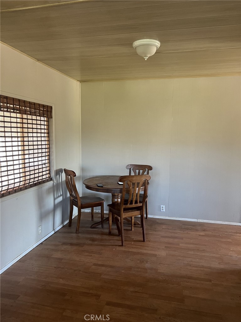 31596 Allen Avenue Homeland, CA 92548 - Photo 16 of 22 a view of a dining room with furniture and wooden floor