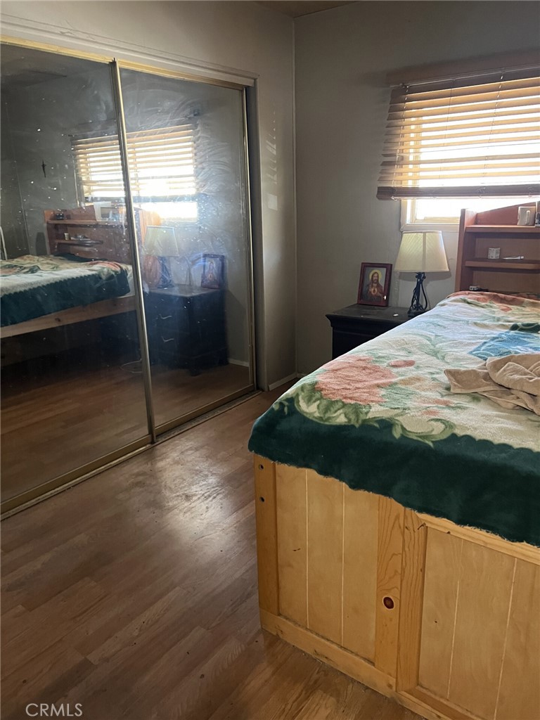 31596 Allen Avenue Homeland, CA 92548 - Photo 18 of 22 a bedroom with a bed and a window