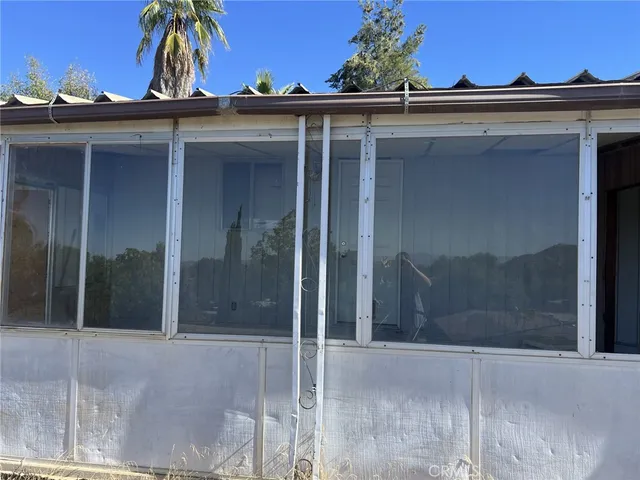 a view of a house with a door and a porch