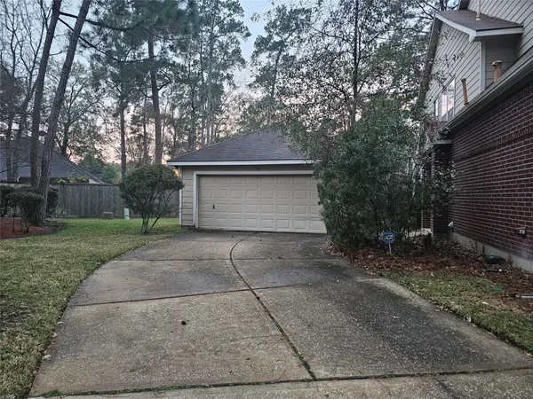 a view of a house with a yard and garage