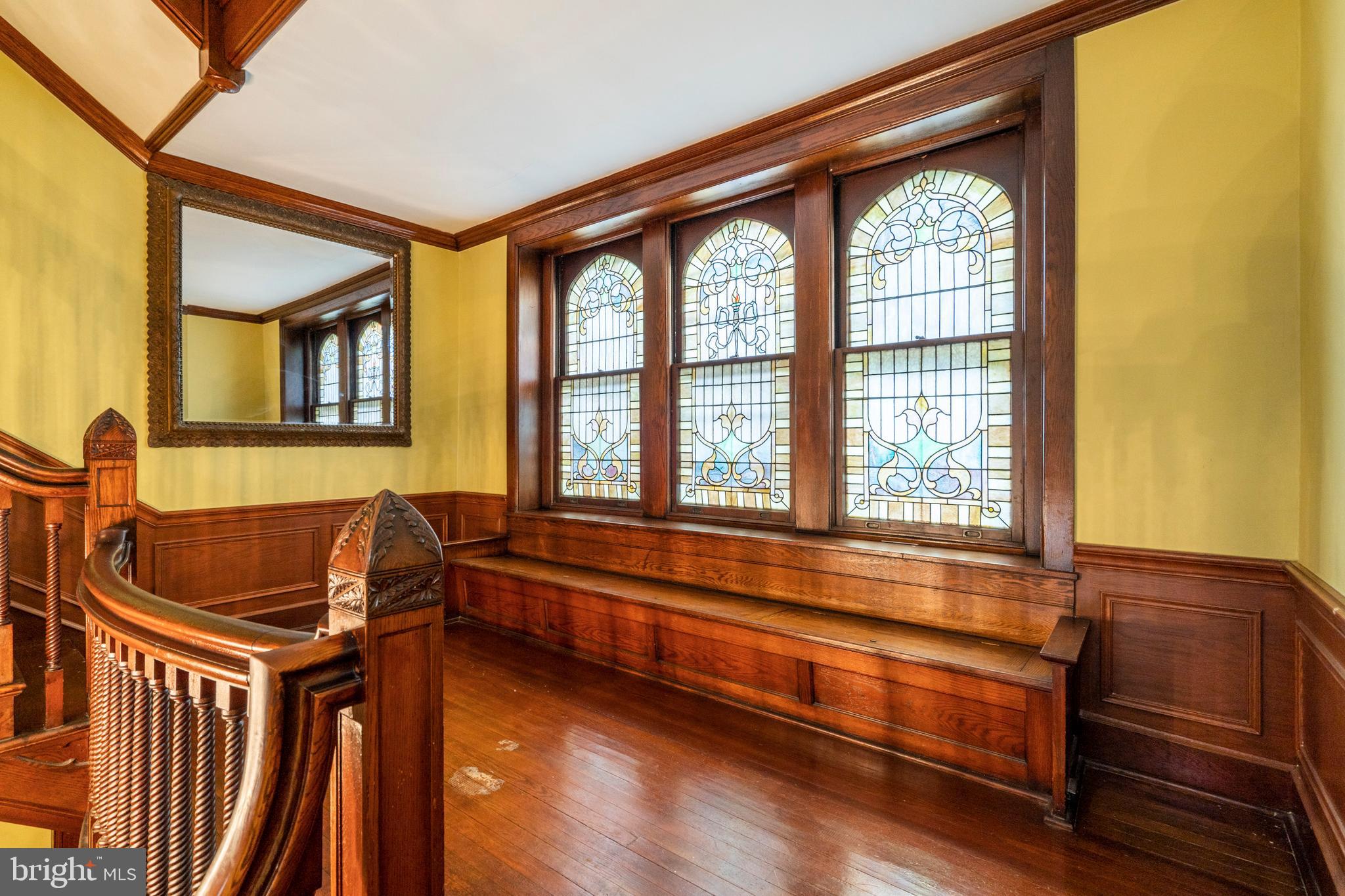 232 Pelham Road Philadelphia, PA 19119 - Photo 21 of 44 2nd floor landing with stained glass