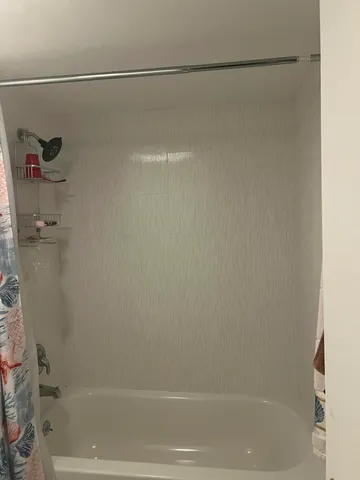 a close view of a bathtub in bathroom