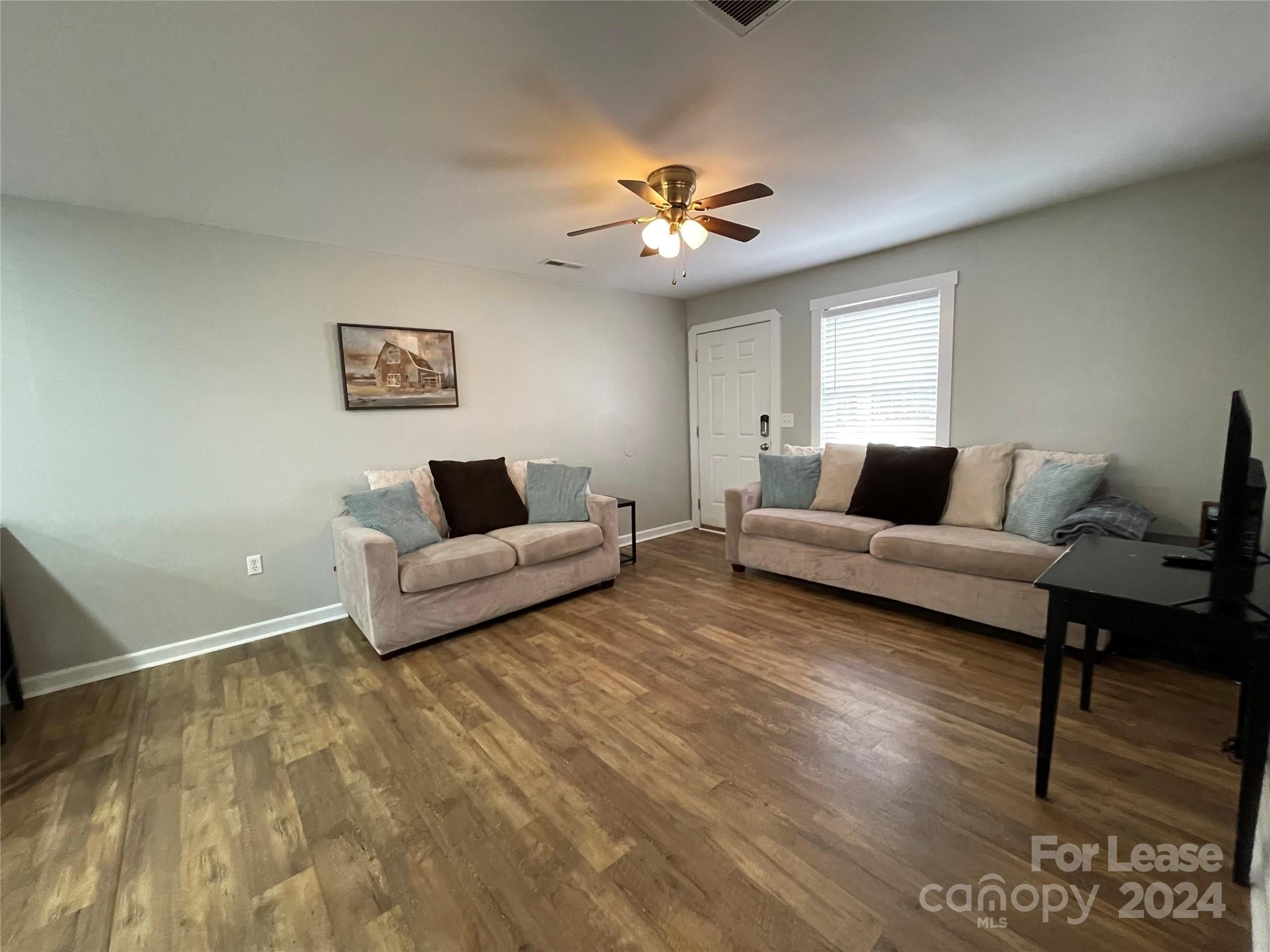 1544 Beth Haven Church Road Denver, NC 28037 - Photo 6 of 13 a living room with furniture and a wooden floor