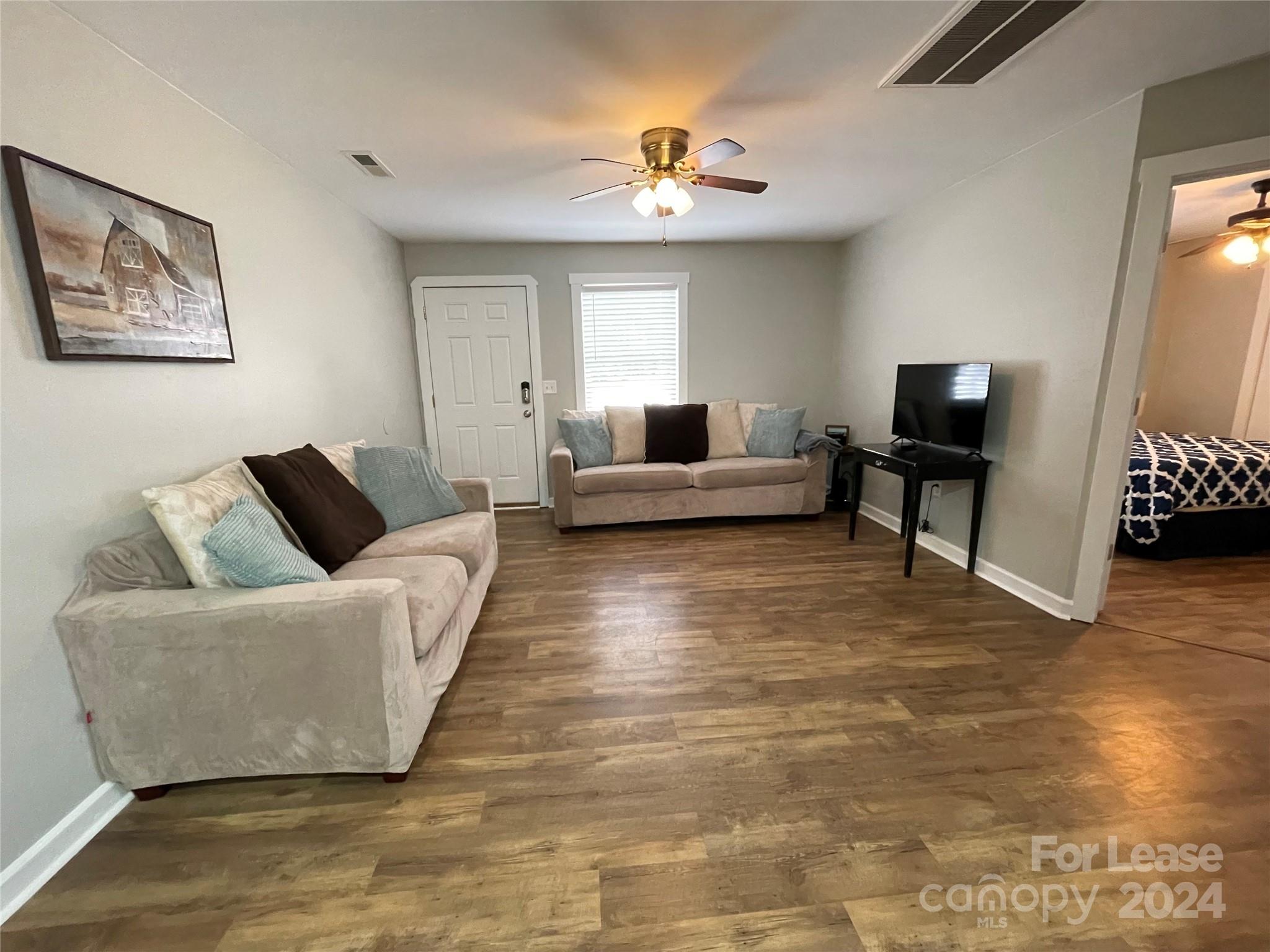 1544 Beth Haven Church Road Denver, NC 28037 - Photo 7 of 13 a living room with furniture and a flat screen tv