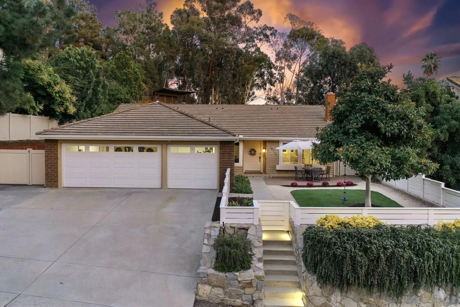 a front view of a house with a yard