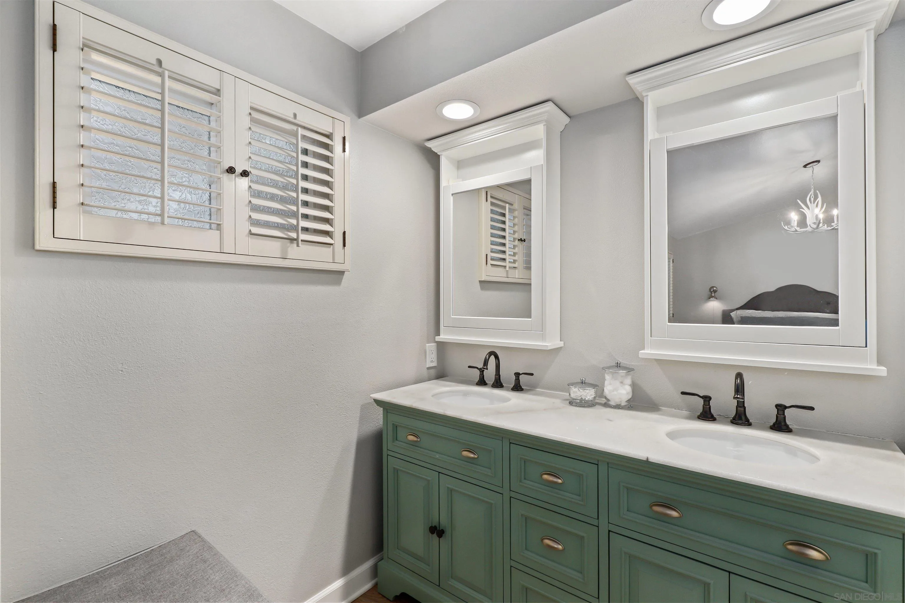 14717 Fieldview Way Poway, CA 92064 - Photo 23 of 35 a bathroom with a sink and a mirror